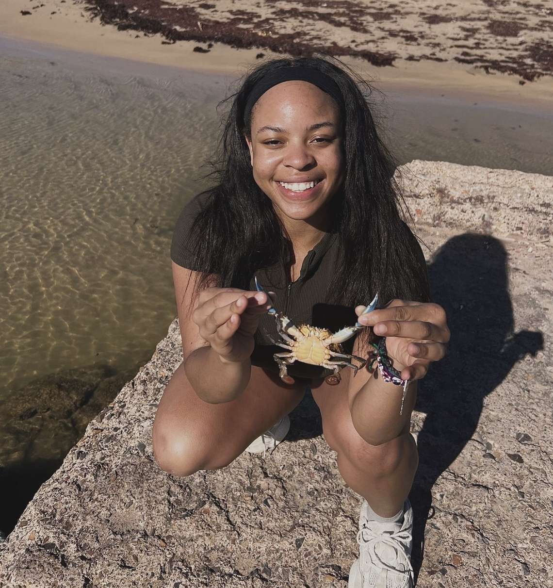 dru holding a crab she caught net fishing in Dom. Republic