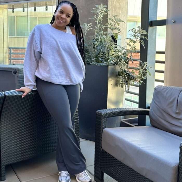 Dru taking a picture on the pool deck at the Hyatt House Hotel